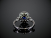 Blue Sapphire and Diamond Halo Ring in 18K White Gold