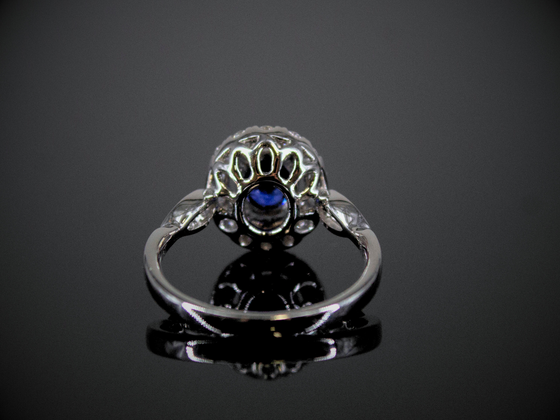 Blue Sapphire and Diamond Halo Ring in 18K White Gold