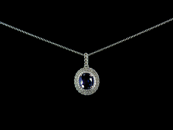 Blue Sapphire and Diamond Halo Necklace in 14K White Gold