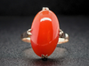 Elongated Oval Red Coral Solitaire Ring in 14K Yellow Gold