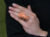 14K Gold Floral Carved Coral Ring with Diamond Accents on Model